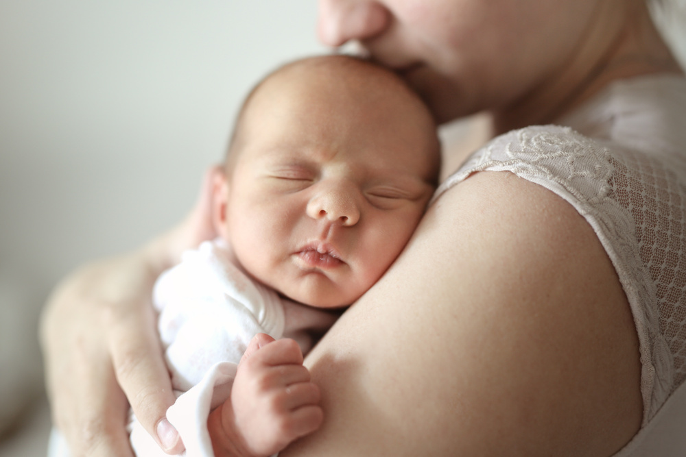 Mom and newborn baby. Light tone and soft toning. Concept motherhood